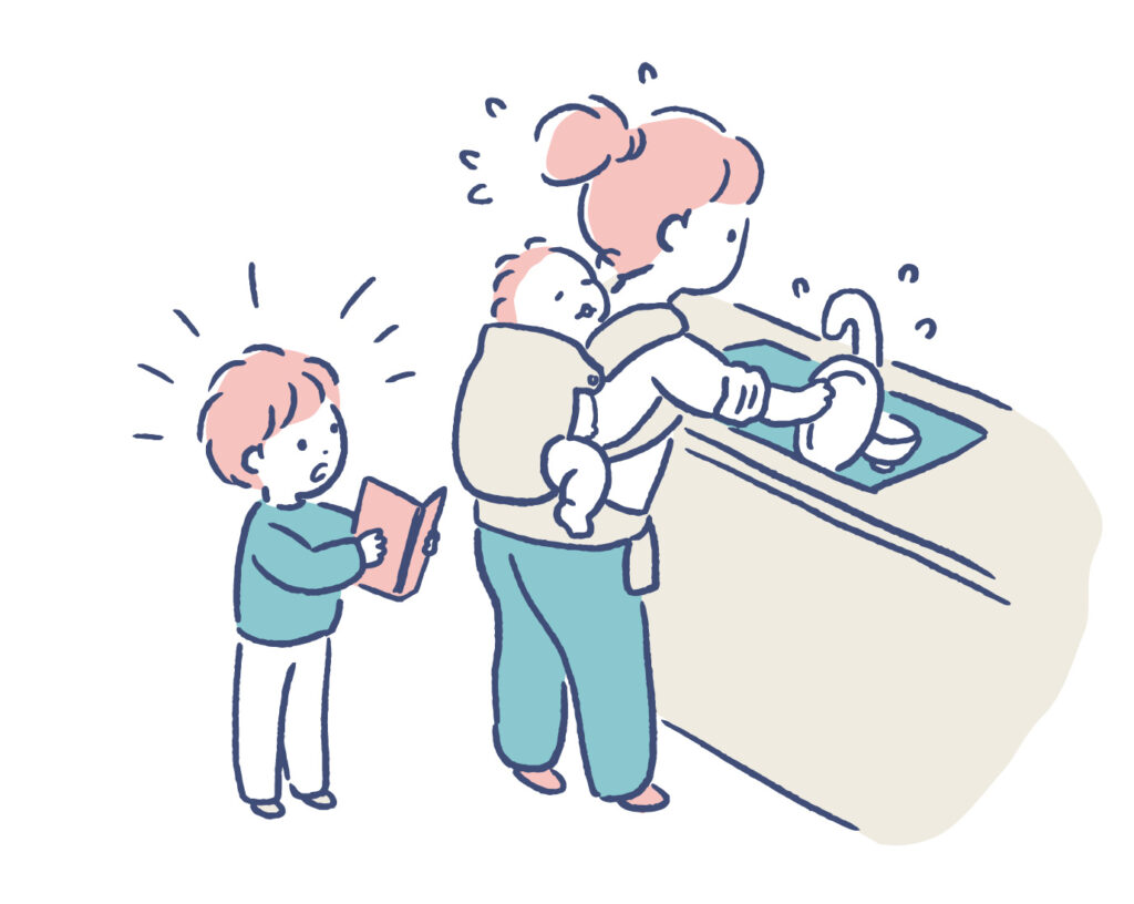 下の子をおんぶして家事をしながら、上の子の相手をするママ